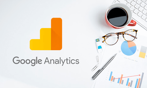 Google Analytics banner with a coffee cup , pen and charts